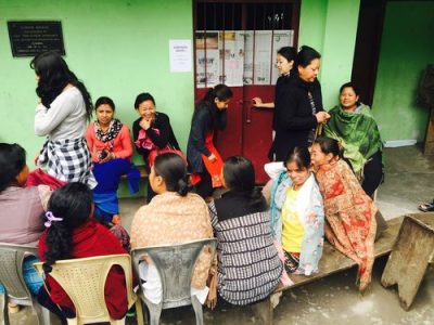 Women+seated+before+examination