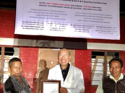 dr Kezevituo receiving certificate of appreciation